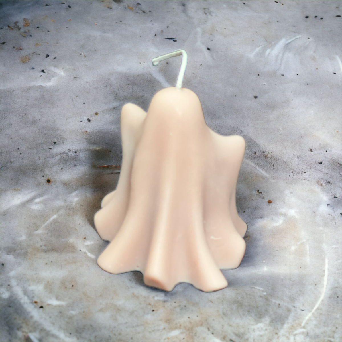 Handmade ghost candle with soft sculptural shape, decorative autumn candle
