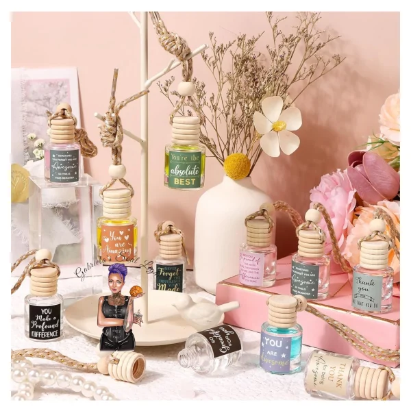 Elegant glass and wood car diffuser bottle hanging from a rearview mirror