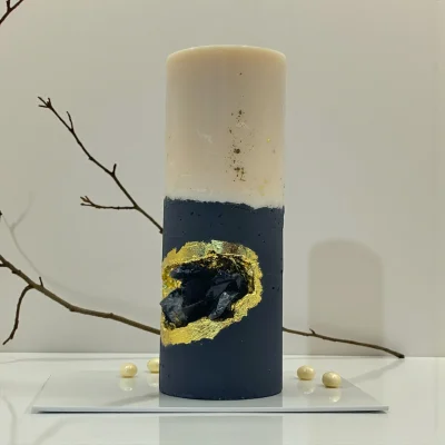 Midnight Ritual luxury handmade soy wax candle with black and ivory layers, gold leaf accents and a natural obsidian crystal, dark statement décor.
